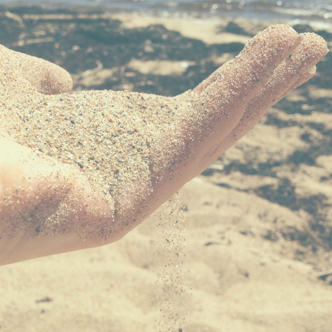 Sand Falling Through Fingers